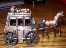 2 8. Die Cast Stagecoach: A stagecoach was once used to carry passengers from place to place. They were also used to deliver mail and goods from town to town.