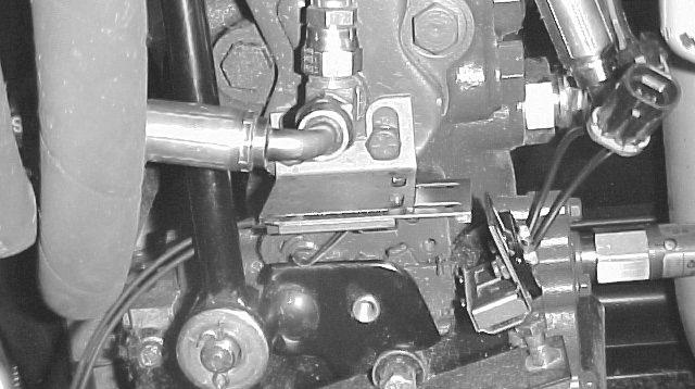 5. To check position and operation of switch, depress traction pedal fully in reverse and measure gap between arm and switch body. Gap should be /8 minimum. Figure. Cam. Switch 6.