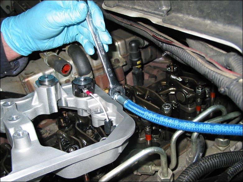 16C ENGINES WITHOUT THE OIL PRESSURE SENSOR Install the #4 JIC to 1/8 NPT fitting, into the end of the M14 ORB to 1/8 NPT fitting, using a high quality thread sealant.