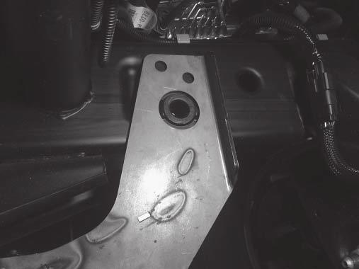 Attach the passenger-side mount and tow hook to the truck frame using the original tow hook fasteners. Hand tighten. 4.