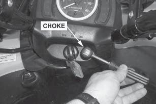 Remove the choke cable from the steering cover by removing the setscrew, handle, boot and the cap holder (plastic nut).