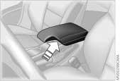 Storage compartments 95n Front center armrest* To open: press the button (arrow) and lift upward.