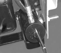 3. Install the cylinder assembly (1) in the mounting bracket of the hitch brace and secure with the clevis pin (L) and an internal cotter pin (K). See Figure 23.