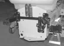 With the lift cylinder arms positioned toward the right, install the rockshaft and bracket asssembly on the hitch plate using four hex cap screws (A) and flange lock nuts (F). See Figure 27.