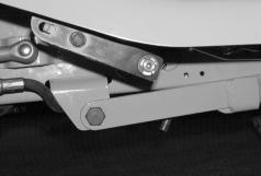 1. From beneath the right running board, remove the hex wash. hd. tapp screws and remove in the following order: the reverse control pedal, forward control pedal, and the brake pedal (See Figure 5).
