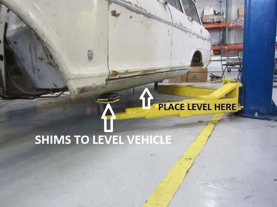 Begin this step with a level on the outer frame rail of the vehicle.