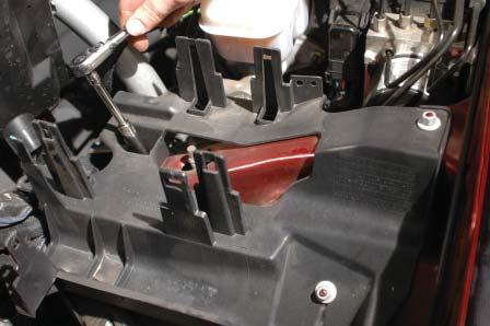On the driver side, the mounting fl ange will hit the bottom of the brake cylinder.