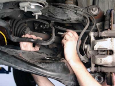 LOOSEN AND REMOVE THE SWAY BAR END LINK USING A WRENCH