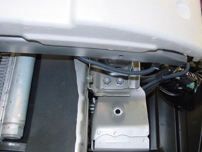 bump stops attaching the radiator cover and fascia to the core support (Fig.E).