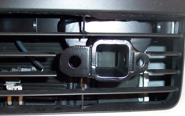 Bolt through the frame rail and into the rear brace using the supplied ½" x 1¼" bolt, flat