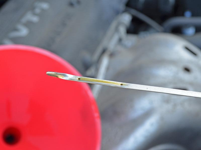 Wipe down the dipstick with a rag or towel, reinsert it, then pull it out again to get a an oil