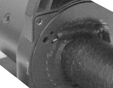 Rotate drum to locate existing hole in flange that is closest to the drum barrel. 4. Feed synthetic rope through aluminum hawse fairlead and under drum. See figure page 4.