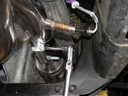 o Rotate the two (2) stainless steel band clamps on the Y -pipe to orient the bolts so they will not create either ground clearance issues or frame clearance problems and fully tight both of them.