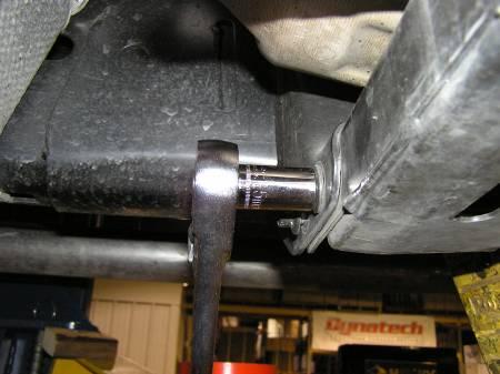 Now that the transmission is properly supported, loosen and remove the four (4) bolts that hold the cross-member to the frame.