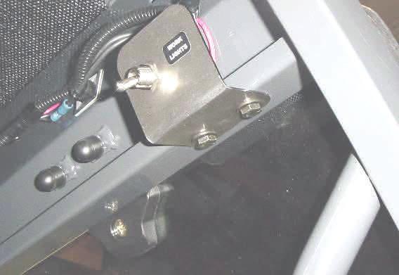 steering column. (Note: A wire hook or snake can be used to pull the wire down through the column easily) Leave 8 out of the hole so there is enough wire to open the windshield.
