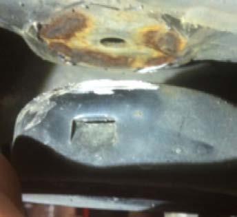 Remove the jounce bumper cups by grinding the welds off as shown in photo 2C.