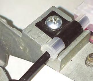 Secure the cable converter assembly to the control panel using the OEM screw in the OEM cable clamp mounting location (See Photo 2, below).