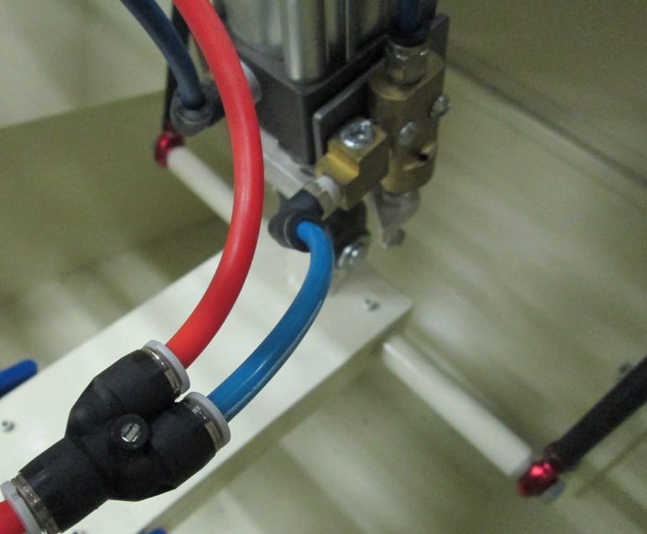 When shipped from the saw s manufacturer, this air line was plugged directly into the air switch. This air line goes to the BMI P2E Blue air line was added.