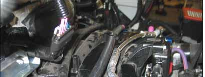 If present, add a 400 mm length of 1 convolute to the OEM coolant crossover hose and secure the