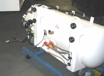 Make sure the tank is centered and positioned horizontally to the frame and the mounting hardware and is in position near the left frame rail. Figure 30.1. 2.