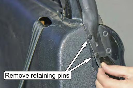 Remove the two small plastic retainers that are located on the forward face of the driver and