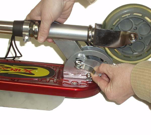 To unfold the scooter, loosen the handlebar folding clamp located at the base of the handlebars. Figure 3 5.