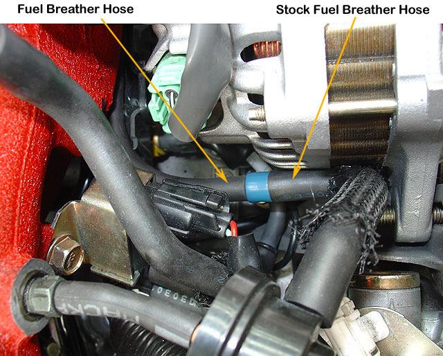 17. Route the fuel breather hose (Item 14) under the stock intake manifold and connect to the stock fuel breather hose located beside stock alternator assembly. 18.