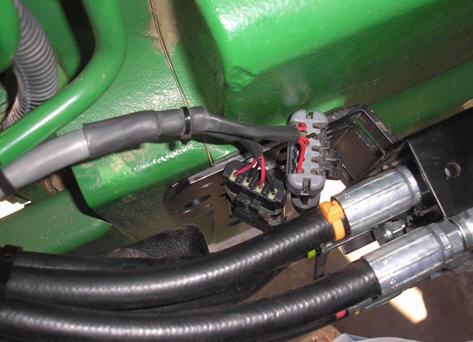 Attach the Cable to the SA Module Connect the SA Module Harness to the Hydraulic Valve Route and secure the steering cable from the SA Module to the steering valve.