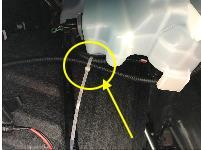 At the passenger side, secure the DRL wire harness to factory harness behind white