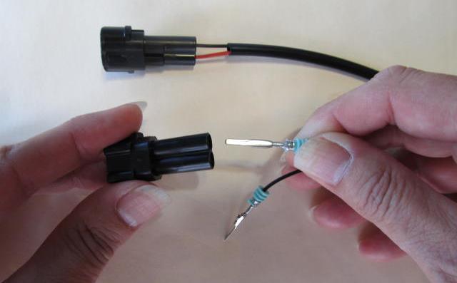Using the driver box as a guide, push the pins of the DRL wire harness into the connector supplied in kit.