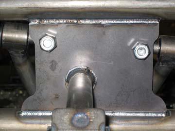 Install the upper control arm into position using the supplied 9/16-18 x 2 1/4 button head bolts.