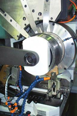 The workhead spindle diameter is eccentric so that the workpart axis can be adjusted to the wheel axis.