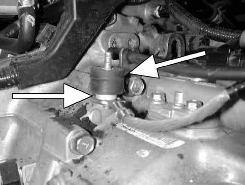 Remove the bolt securing the grounding wire to the transmission.
