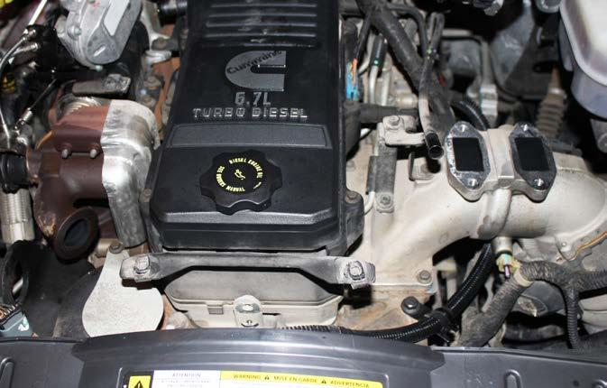 Remove the entire air intake assembly from the vehicle with the breather hose still attached to the
