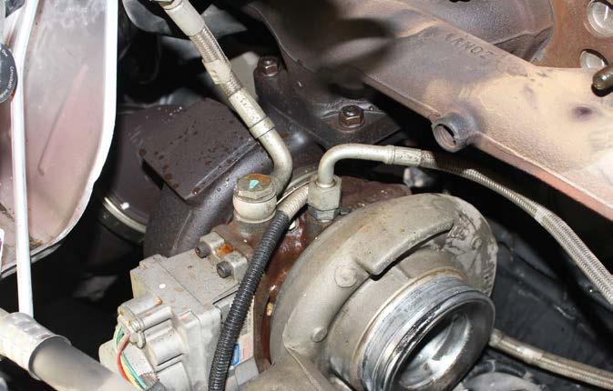 Disconnect the lower coolant line from the engine block.
