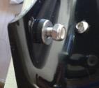 In order to access the bottom adjuster with the fairing on, turn the handlebars to the right.