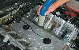 . Remove the intake manifold by loosening the ten manifold