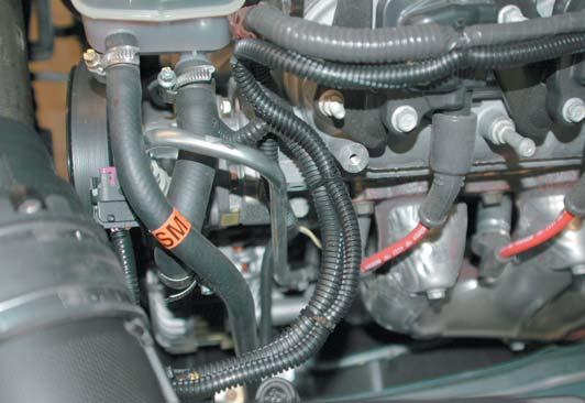 61. Using the new Intake Air Tempeture (IAT) harness and crimp/shrink connectors supplied, connect the white 62 wires to either white wire of the new IAT harness.