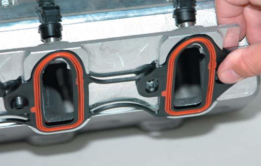 Install the fuel manifold O-ring into the recess on the fuel rail with some of the grease
