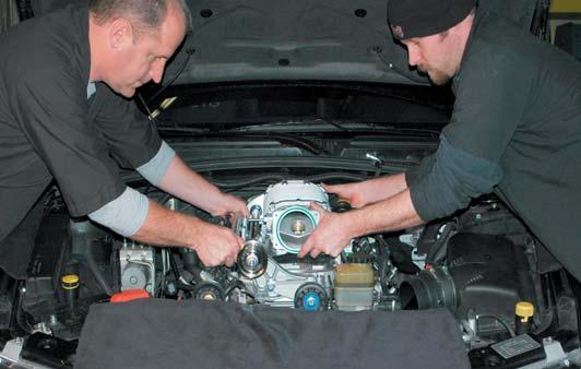 73. With the help of a assistant carefully set the supercharger and manifold assembly