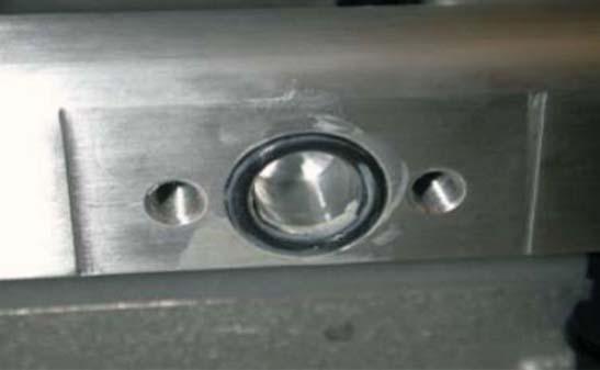 the machined recessed area on the new driver side fuel rail as shown.