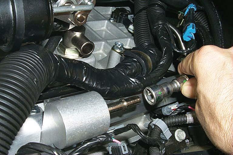 73. Install the tensioner assembly into the vehicle as