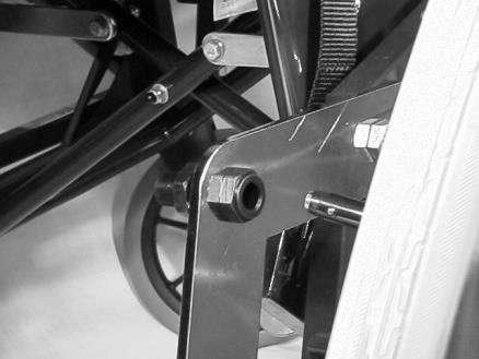 To remove the wheel press the button on the end of the quick release wheel axle and pull the wheel from the wheelchair.