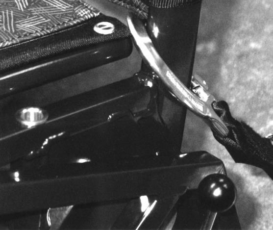 Rear Restraint Location Point Karabiner hooked around the backrest tube just above the joint of the backrest with the upper side frame i.e. between the seat and backrest upholstery.