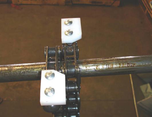 This can be helpful when installing paddles to chain. 4- Install left-hand paddles on every other lug of the left Gathering chain.