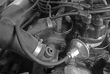 Drain the radiator. 4. Loosen the cable clamp and disconnect the cable from OEM heater control valve (See Photo 2, below). 5.