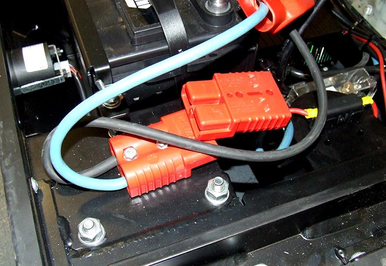 BEFORE PERFORMING ANY PROCEDURES ON THE BATTERIES, disconnect the main red connector under the rear cover.