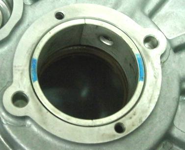The CVT cover has to be supported from below with suitable support with straight surface, in order to prevent damage of the sealing surface.