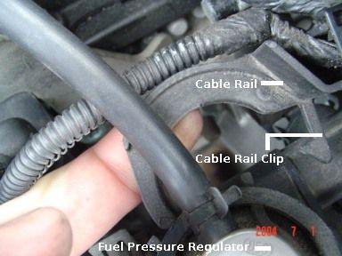 Unclip the cable rail from the fuel pressure regulator and wiggle it way. This will give you extra space for the boot tool.