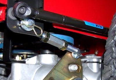 DRIVE CONTROL HANDLE ADJUSTMENT Before any adjustments are made to the drive control arms; put an equal amount of air pressure in both rear wheel.